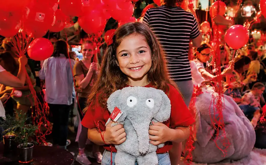 Girl with Toy elephant bear therapeutic tool